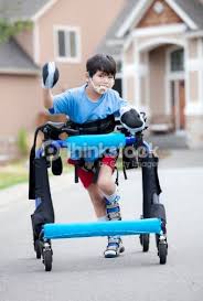 Six Year Old Disabled Boy Walking In Walker Running Down The Street In 2020 Gait Training Special Needs Kids Working With Children