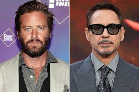 Armie Hammer denies reports that Robert Downey Jr. paid for him to enter  rehab, as well as claims of cannibalism: "You know what you have to do to  be a cannibal? You