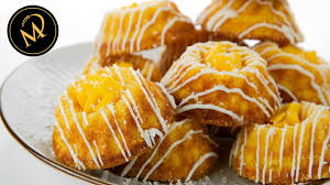 Ein rezept was mit sicherheit die meinungen spaltet und nicht jedermanns sache. Mango Kokos Hupf Exotischer Kuchen Im Mini Format Youtube