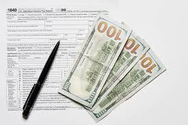 Income tax return (itr) is a form through which you report the details of your income earned from various sources and thereon pay taxes to the income tax department. Income Tax Return 1040 Tax Form And Hundred Dollar Bills On White Background Creative Commons Bilder