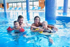 Mom And Dad Playing With Their Kids In The Swimming Pool Stock Photo Spon Playing Kids Mom Dad Ad Swimming Pools Pool Mom And Dad