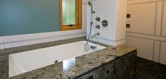 Has been improving the level of gracious living among its customers by providing exceptional products and services for the. Lee Edwards Residential Design Modern Bathroom Designs With Granite Tub Surrounds And Undermount Kohler Tea For Two Tub Curbless Slate Shower Glass Accent Tile
