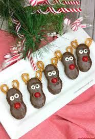 Dip wide part of each peanut butter cup in blue candy coating, place on top of one end of each decorated cookie. Reindeer Nutter Butter Treats Gonna Want Seconds
