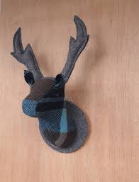 Hanging instruments on a wall is a great way to save space and show off your collection at the same time. Deer Head Wall Hanging Tarn Felt