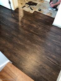 What does transition pieces look like when installed with vinyl flooring : How To Install Vinyl Plank Over Tile Floors The Happy Housie