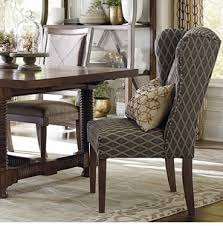High back comfortable wing chair with low arms and removable seat cushion. Dining Chairs Dining Room