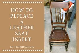 a leather seat in an antique chair