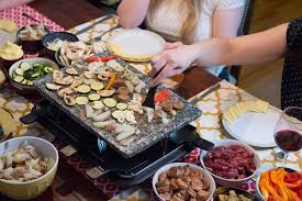 Have a grill on top, so while your cheese is broiling under the grill, you can cook up some vegetables (or even kebabs or merguez sausage) on top of it. Raclette Dinner Party East Coast Food Stories