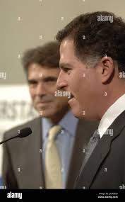 Texas Gov. Rick Perry, left, speaks with Rep. Craig Eiland, D-Galveston,
