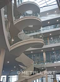 A glass infill keeps things clean and contemporary, while mesh or rod railing lends an industrial edge. Glass Railing For An Elegant Atrium Metallart Stairs