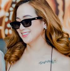 Who is available for a hot stone massage in Lansing, MI tomorrow?