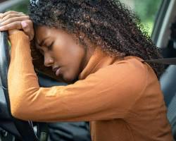 Image of someone looking stressed while searching for a parking spot