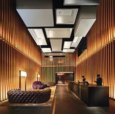 The golden space is an international organisation providing healing, meditation, and transformational services in both the individual and corporate arenas. A Golden Cage Connects He Warm And Modern Reception Area With The Lobby And Lounge Bar Plafond Design Architecture Interieure Interieur Design