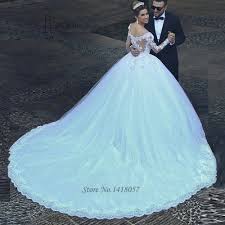 Inspired by classic romance, ballgown wedding dresses feature full, voluminous skirts draped in soft tulle or sophisticated satin. White Arabic Bridal Dresses 2017 Puffy Ball Gown Wedding Dresses Long Sleeve Lace Dubai Princess Wedding Gowns Vestido De Noiva Buy At The Price Of 151 20 In Aliexpress Com Imall Com