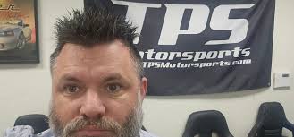 Ken talking with Bruce McLaren.