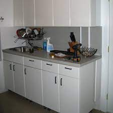 Sanding your kitchen cabinets also means removing any surface pimples (or imperfections), and creating small, rough ridges that allow for better adhesion. Kitchen Project Cheri Shows Us How To Paint Ugly Laminate Kitchen Countertops Kitchn