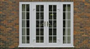 Traditional wood french doors have many small panes of glass. French Doors By Thermoshield Windows Ltd