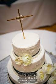 Three Tier Cake With Cross And Wedding Ring Cake Topper Click To View Full Gallery Traditional Catholic Wedding W Ring Cake Ring Cake Topper Wedding Cake Table