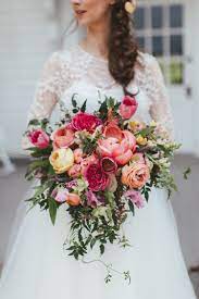 The flowers are secured in a foam bouquet holder with handle. Tennessee And Collin Chic Colorful Wedding In Dallas Tx Rosemary Finch Floral Design Nashville Tn Cascading Bridal Bouquets Wedding Bouquets Bridal Bouquet