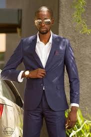 Slim fit suits in bold patterns (e.g. Zed Suits Lusaka Zambia Facebook