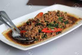 Add the seitan or crumbled tofu and stir fry rapidly for a minute or two until hot and starting to brown. Pad Krapao Moo Wurzig Gebratenes Schweinefleisch Mit Thai Heilige Basilikum Und Chili Lizenzfreie Fotos Bilder Und Stock Fotografie Image 24404737