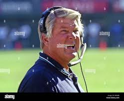 Miami Dolphins head coach Jimmy Johnson walks to U.S. District Court in  Miami Monday, Aug. 2, 1999 for the trial of Dolphins wide receiver Tony  Martin. Jury selection began Monday for the