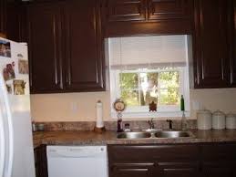Dark Brown Kitchen Cabinets With Tan Walls Small Kitchen Colors Brown Kitchen Interior Kitchen Colors