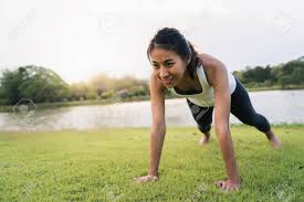 Warm up before yoga in the morning. Healthy Young Asian Runner Woman Warm Up Her Body By Push Up Stock Photo Picture And Royalty Free Image Image 129706415
