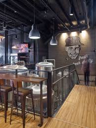 This Industrial Inspired Brew Pub And Restaurant Design Features A Large Wall Mural And Glimpses Of The Beer Making Brewery Design Pub Interior Beer Bar Design