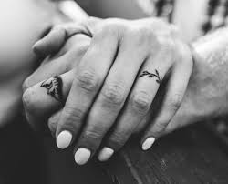 Top 59 Best Wedding Ring Tattoo Ideas 2021 Inspiration Guide Ring Tattoo Designs Wedding Band Tattoo Wedding Finger Tattoos