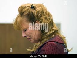 Brinda Sue McCoy, wife of Oceanside police Chief Frank McCoy, reacts in  court, Monday, June 18, 2012, in Santa Ana, Calif. McCoy was convicted  Monday of five counts of assault