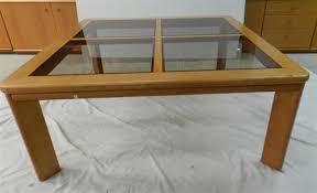 A chiswell timber veneer extendable coffee table with smoke glass shelf, 49 x 113 x 50 cm, (closed) show 35 more like this. Sold Price A Parker Timber Glass Coffee Table Invalid Date Aest