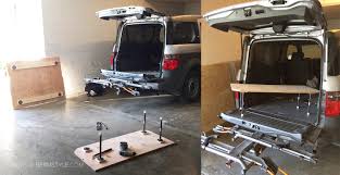 Bed is 74 long x 25 wide x 12 high, 5/8 birch cabinet plywood (painted grey), on 2x2 legs; Our Honda Element Adventuremobile