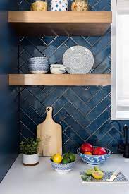The blue backsplash contrasts with the tone, style, and pattern of the floor tiles, while stainless steel appliances bring modernity to space. Contemporary Kitchen With Vaulted Ceilings Hgtv Faces Of Design 2018 Hgtv Vaulted Ceiling Kitchen Blue Kitchen Cabinets Blue Backsplash Kitchen