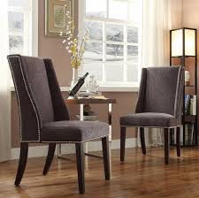 Wingback chairs were invented in the 17th century to be fireside chairs—i.e. Robot Check Dining Chairs Nailhead Chair Chair