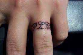 That was all about the more than 60 m letter tattoo designs which. 19 Ring Finger Tattoo Ring Tattoo Designs Tattoo Wedding Rings Wedding Band Tattoo