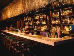 White kitchen with driftwood peninsula. Three Dots And A Dash Restaurants Food Network Food Network