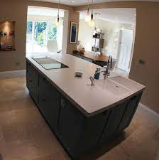 This stunning grey and dark blue kitchen oozes sophistication. Electric Hob And Double Sink In Island Kitchen Island With Sink Kitchen Sink Design Kitchen Island With Hob