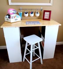So when i began planning my ultimate craft room, i knew i needed an amazing craft table with storage. Diy Inexpensive Craft Table With Storage The Taylor House