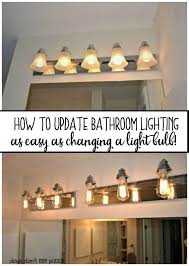 How To Update Bathroom Lighting It S As Easy As Changing A Lightbulb Dogs Don T Eat Pizza Rustic Bathroom Lighting Bathroom Lighting Bathroom Update