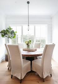 (dining tables) the first dining tables of which survivors remain are the type known as refectory tables. Round Reclaimed Wood Dining Table Linen Chairs Cottage Dining Room