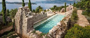 An old stone sink and painted grain bin are part of the patina of the old house. Photos Exquisitely Renovated 15th Century Dalmatian Stone House Croatia Week