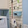 A great small utility room idea is to pack all your storage on the wall above you washing machine so you don't take up any of the limited floor space. 1