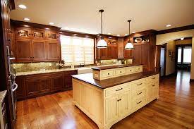 Dark and light stain on walnut cabinetry: Kitchen 2 Fehrenbacher Cabinets Inc