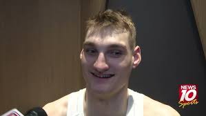 East Lansing's Cameron Hutson eclipses 1,000 career points in EL's district  title win over Okemos