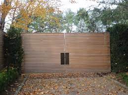 Modern aluminium driveway gate is enhanced by highly secure locks that are difficult to disrupt. 25 Naturally Stunning Wooden Driveway Gate Design Ideas