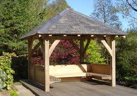 A timber frame attached pergola over a porch can also easily create a wonderful extension of a kitchen as well as eating and dining room spaces better suited for socializing. Traditional Oak Timber Frame Manufacture Devon