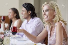 Guests do not handle serving platters nor do they pass dishes. Young Woman In Dress Sitting At Table Of Formal Dinner Party Stock Photo Picture And Royalty Free Image Image 19521847