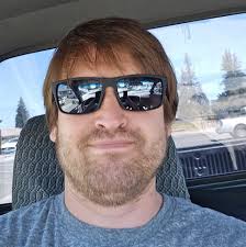 VHS quality of a 1997 Chevrolet Suburban sitting in front of Wendy's eating  a Dave's double burger.