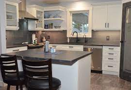 An open and airy kitchen featuring new caledonia granite. Merit Kitchens On Twitter Throwbackthursday Tbt Following Up From Our Contest Last Week Drum Roll Please And The Winner Is White Cabinets Artic White With Dark Grey Countertops Oiled Soapstone And Dark